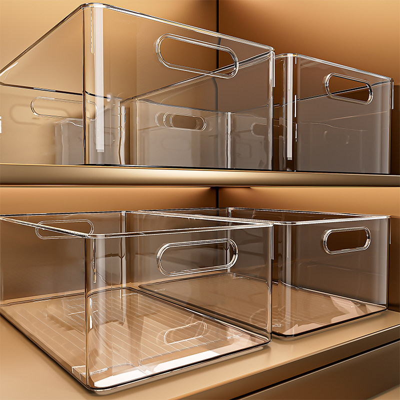 The cabinet is emptying up the cranium and groceries and the transparent basket table and the rectangular storage box.